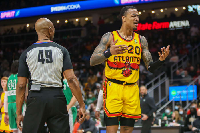 Atlanta Hawks forward John Collins reacts to a foul call during a game against the Boston Celtics.